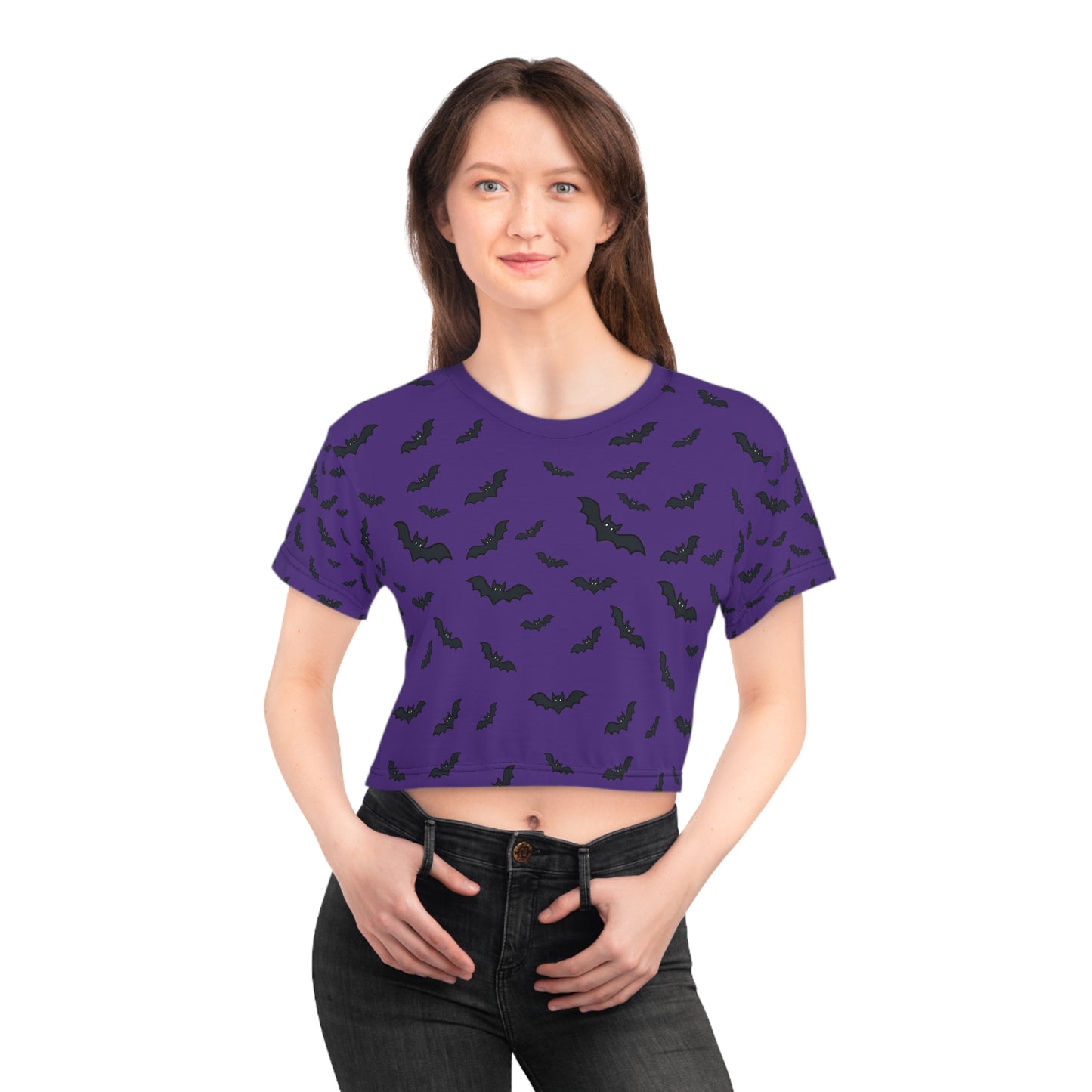 Woman wearing a purple t-shirt with black bat pattern on a white background